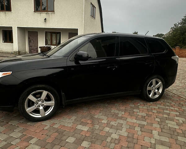 Черный Мицубиси Аутлендер, объемом двигателя 2.36 л и пробегом 70 тыс. км за 9000 $, фото 7 на Automoto.ua