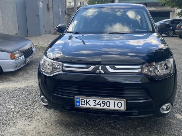 Черный Мицубиси Аутлендер, объемом двигателя 2 л и пробегом 168 тыс. км за 12007 $, фото 1 на Automoto.ua