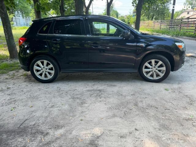 Черный Мицубиси Аутлендер, объемом двигателя 2 л и пробегом 195 тыс. км за 9990 $, фото 3 на Automoto.ua