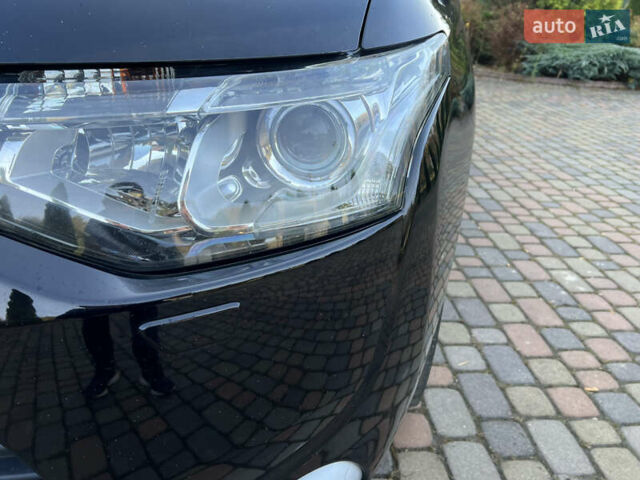 Черный Мицубиси Аутлендер, объемом двигателя 2 л и пробегом 190 тыс. км за 12500 $, фото 13 на Automoto.ua