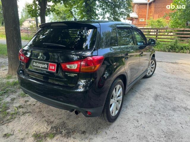 Черный Мицубиси Аутлендер, объемом двигателя 2 л и пробегом 195 тыс. км за 9990 $, фото 4 на Automoto.ua