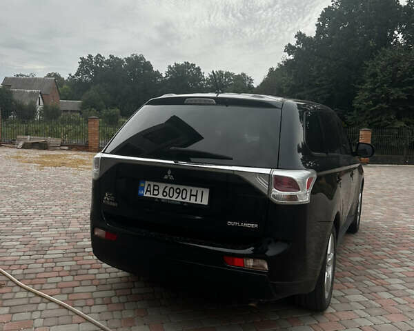 Черный Мицубиси Аутлендер, объемом двигателя 2.36 л и пробегом 70 тыс. км за 9000 $, фото 4 на Automoto.ua