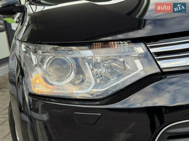 Чорний Міцубісі Аутлендер, об'ємом двигуна 2 л та пробігом 157 тис. км за 15299 $, фото 7 на Automoto.ua