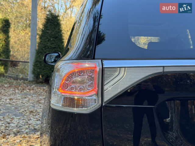 Чорний Міцубісі Аутлендер, об'ємом двигуна 2 л та пробігом 173 тис. км за 15299 $, фото 66 на Automoto.ua