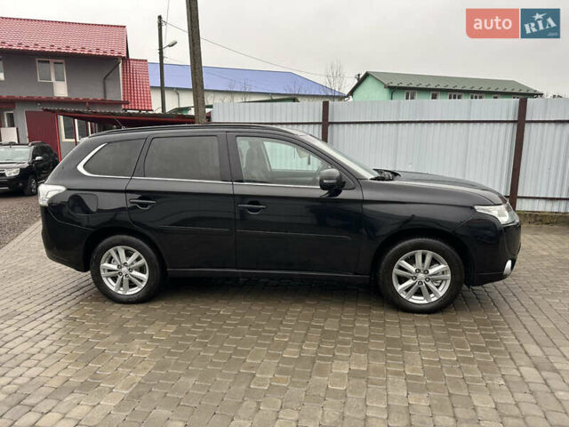 Черный Мицубиси Аутлендер, объемом двигателя 2 л и пробегом 223 тыс. км за 13400 $, фото 3 на Automoto.ua