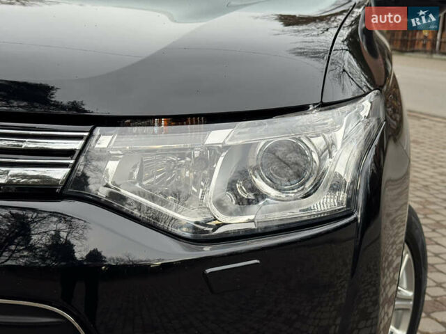 Черный Мицубиси Аутлендер, объемом двигателя 2 л и пробегом 173 тыс. км за 15299 $, фото 24 на Automoto.ua