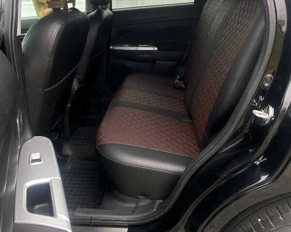 Чорний Міцубісі Аутлендер, об'ємом двигуна 2 л та пробігом 250 тис. км за 10800 $, фото 17 на Automoto.ua