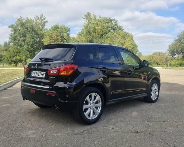 Чорний Міцубісі Аутлендер, об'ємом двигуна 2 л та пробігом 83 тис. км за 13500 $, фото 7 на Automoto.ua