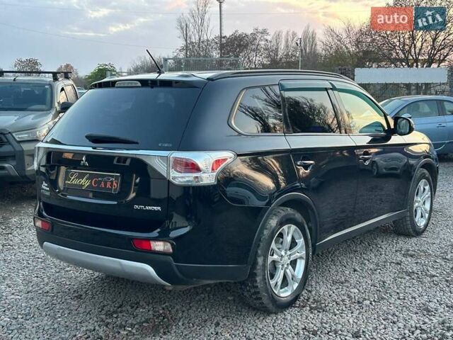 Чорний Міцубісі Аутлендер, об'ємом двигуна 2.4 л та пробігом 199 тис. км за 12800 $, фото 4 на Automoto.ua