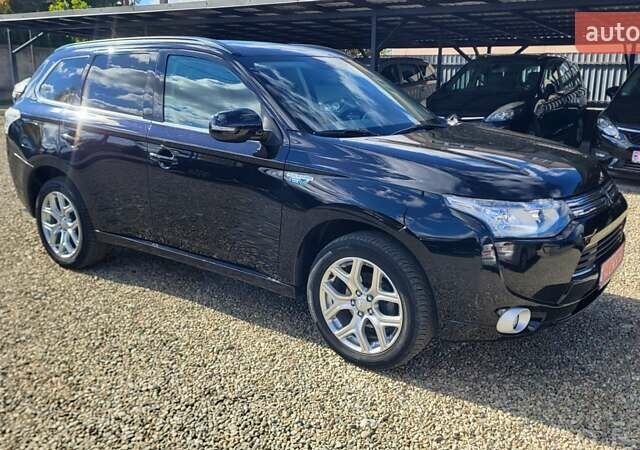 Чорний Міцубісі Аутлендер, об'ємом двигуна 2 л та пробігом 237 тис. км за 13800 $, фото 9 на Automoto.ua