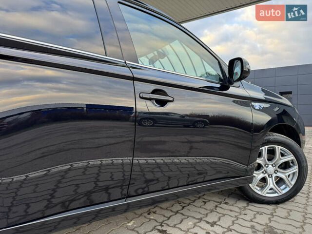 Чорний Міцубісі Аутлендер, об'ємом двигуна 2 л та пробігом 157 тис. км за 15299 $, фото 50 на Automoto.ua