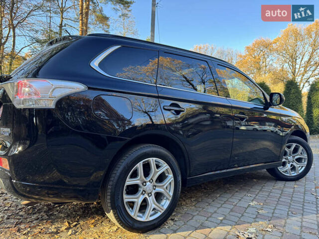 Чорний Міцубісі Аутлендер, об'ємом двигуна 2 л та пробігом 173 тис. км за 15299 $, фото 55 на Automoto.ua