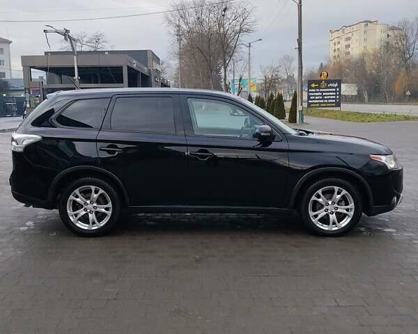 Чорний Міцубісі Аутлендер, об'ємом двигуна 2.4 л та пробігом 224 тис. км за 12000 $, фото 12 на Automoto.ua