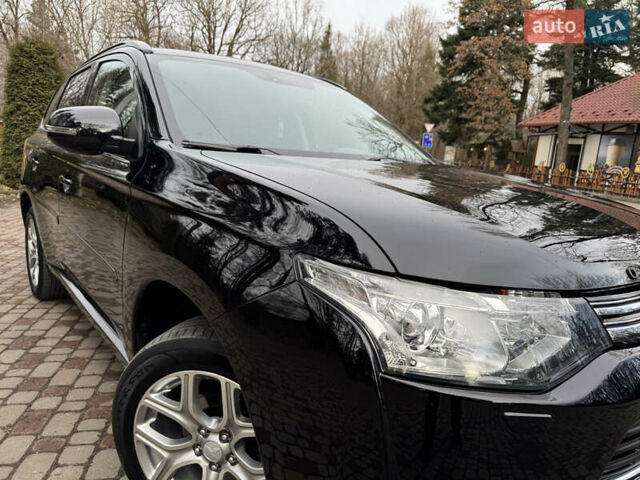 Черный Мицубиси Аутлендер, объемом двигателя 2 л и пробегом 173 тыс. км за 15299 $, фото 13 на Automoto.ua