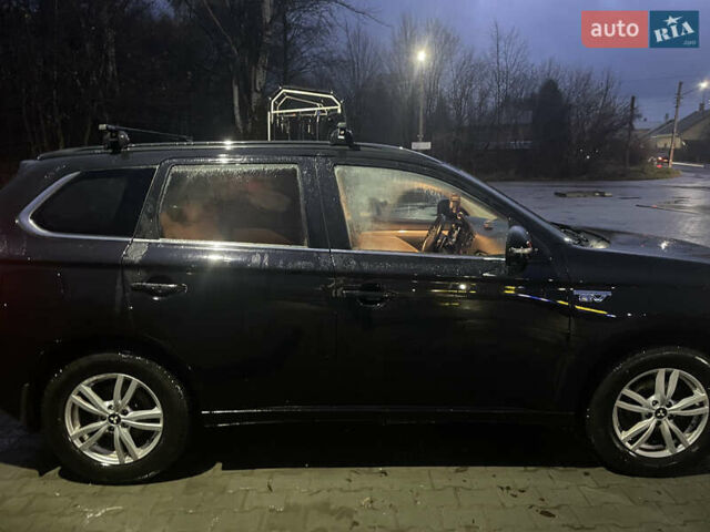 Черный Мицубиси Аутлендер, объемом двигателя 2 л и пробегом 206 тыс. км за 14500 $, фото 2 на Automoto.ua