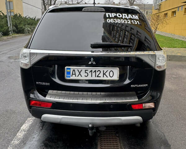 Черный Мицубиси Аутлендер, объемом двигателя 2.27 л и пробегом 244 тыс. км за 14000 $, фото 6 на Automoto.ua