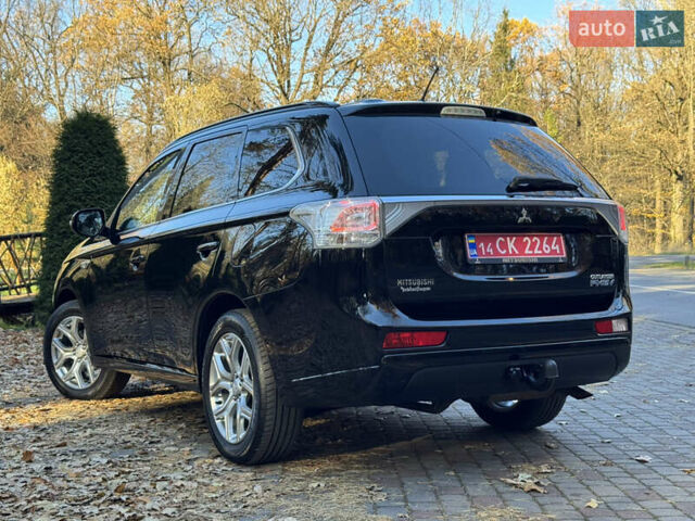 Чорний Міцубісі Аутлендер, об'ємом двигуна 2 л та пробігом 173 тис. км за 15299 $, фото 62 на Automoto.ua