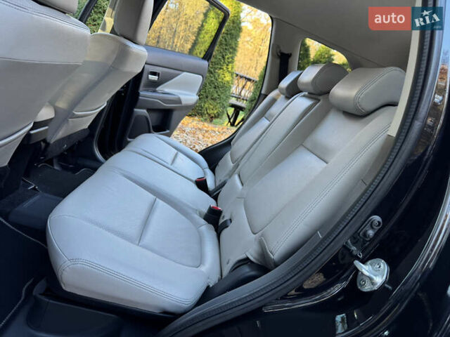 Чорний Міцубісі Аутлендер, об'ємом двигуна 2 л та пробігом 173 тис. км за 15299 $, фото 110 на Automoto.ua