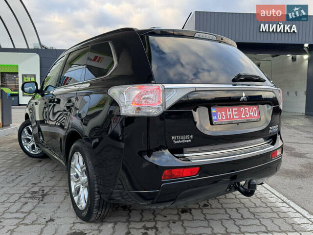 Чорний Міцубісі Аутлендер, об'ємом двигуна 2 л та пробігом 157 тис. км за 15299 $, фото 57 на Automoto.ua