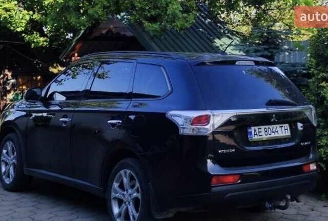 Черный Мицубиси Аутлендер, объемом двигателя 2.4 л и пробегом 220 тыс. км за 13400 $, фото 1 на Automoto.ua
