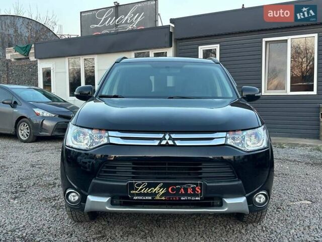 Чорний Міцубісі Аутлендер, об'ємом двигуна 2.4 л та пробігом 199 тис. км за 12800 $, фото 1 на Automoto.ua