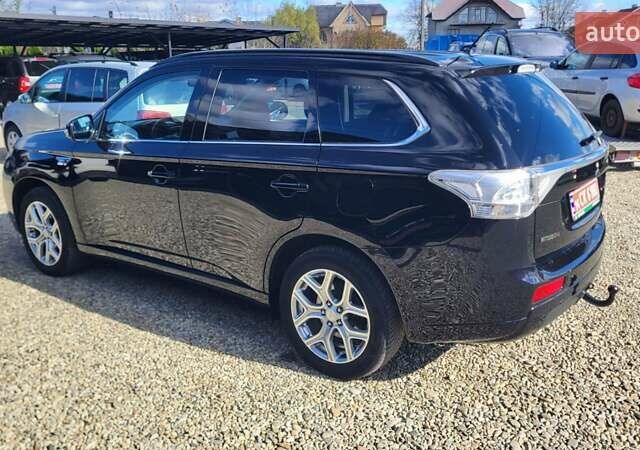 Чорний Міцубісі Аутлендер, об'ємом двигуна 2 л та пробігом 237 тис. км за 13800 $, фото 2 на Automoto.ua