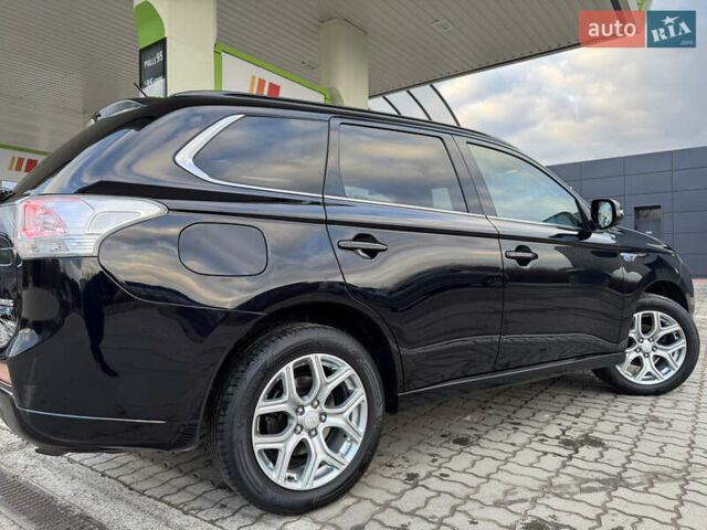Чорний Міцубісі Аутлендер, об'ємом двигуна 2 л та пробігом 157 тис. км за 15299 $, фото 48 на Automoto.ua