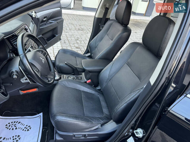 Чорний Міцубісі Аутлендер, об'ємом двигуна 2 л та пробігом 157 тис. км за 15299 $, фото 69 на Automoto.ua