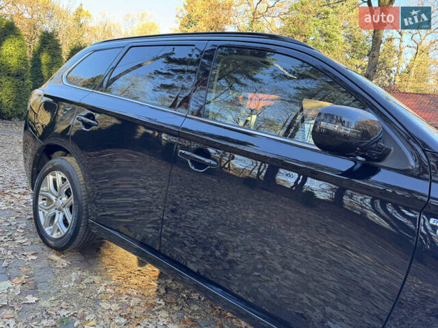 Чорний Міцубісі Аутлендер, об'ємом двигуна 2 л та пробігом 173 тис. км за 15299 $, фото 20 на Automoto.ua