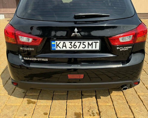 Чорний Міцубісі Аутлендер, об'ємом двигуна 2 л та пробігом 211 тис. км за 9500 $, фото 1 на Automoto.ua