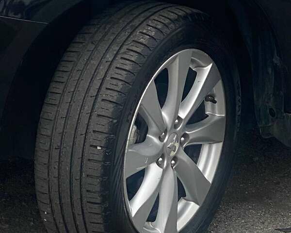 Чорний Міцубісі Аутлендер, об'ємом двигуна 2 л та пробігом 250 тис. км за 10800 $, фото 20 на Automoto.ua