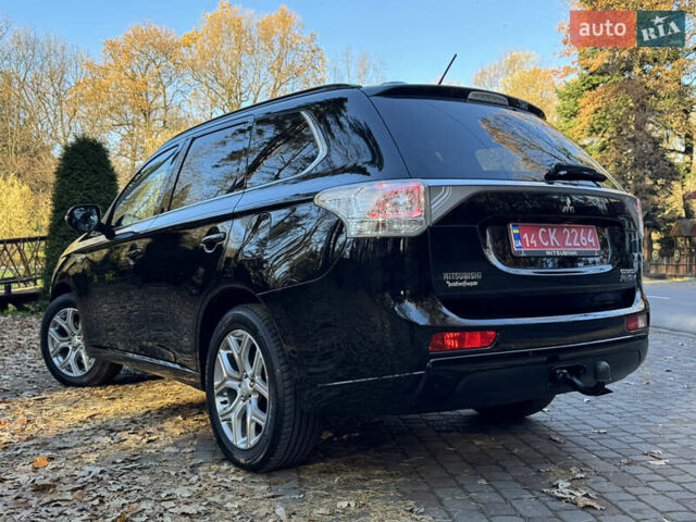 Чорний Міцубісі Аутлендер, об'ємом двигуна 2 л та пробігом 173 тис. км за 15299 $, фото 69 на Automoto.ua