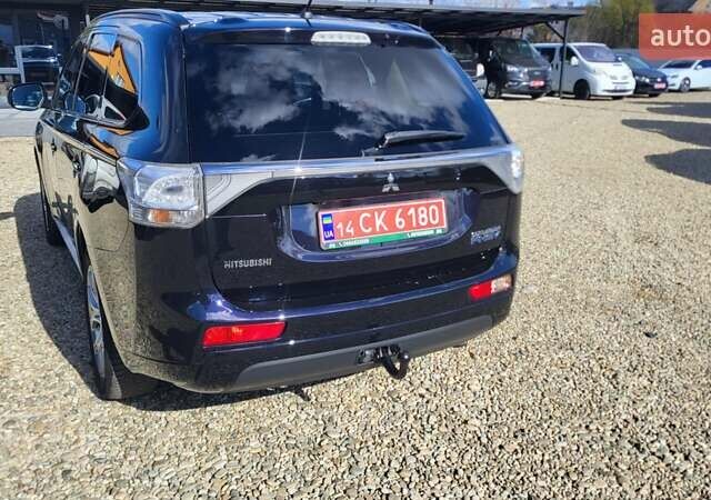 Чорний Міцубісі Аутлендер, об'ємом двигуна 2 л та пробігом 237 тис. км за 13800 $, фото 4 на Automoto.ua