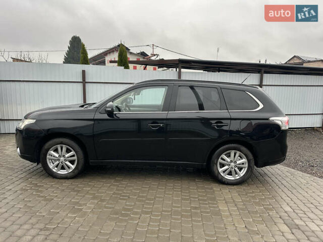 Черный Мицубиси Аутлендер, объемом двигателя 2 л и пробегом 223 тыс. км за 13400 $, фото 4 на Automoto.ua