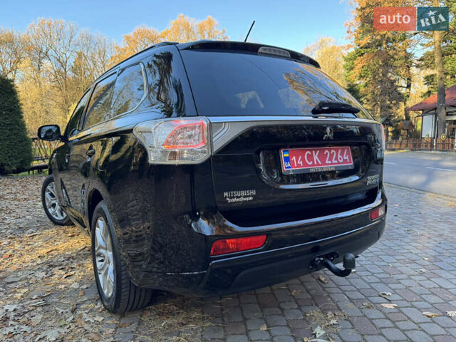 Чорний Міцубісі Аутлендер, об'ємом двигуна 2 л та пробігом 173 тис. км за 15299 $, фото 70 на Automoto.ua