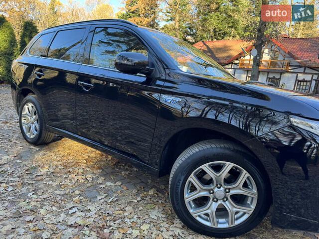 Чорний Міцубісі Аутлендер, об'ємом двигуна 2 л та пробігом 173 тис. км за 15299 $, фото 13 на Automoto.ua