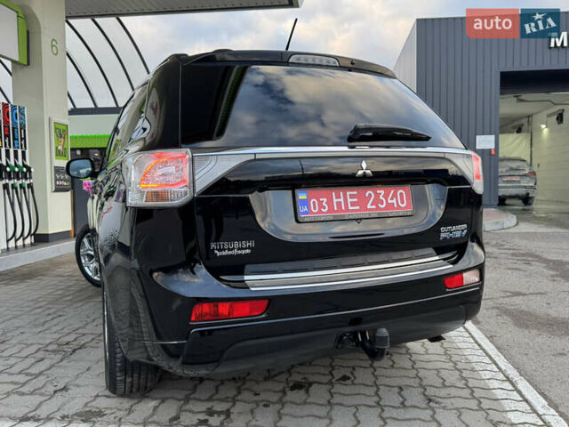 Чорний Міцубісі Аутлендер, об'ємом двигуна 2 л та пробігом 157 тис. км за 15299 $, фото 58 на Automoto.ua
