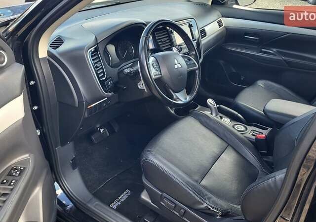 Чорний Міцубісі Аутлендер, об'ємом двигуна 2 л та пробігом 237 тис. км за 13800 $, фото 13 на Automoto.ua