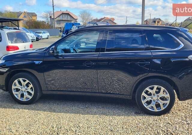 Чорний Міцубісі Аутлендер, об'ємом двигуна 2 л та пробігом 237 тис. км за 13800 $, фото 1 на Automoto.ua