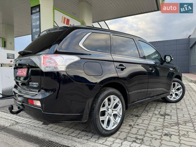 Чорний Міцубісі Аутлендер, об'ємом двигуна 2 л та пробігом 157 тис. км за 15299 $, фото 47 на Automoto.ua