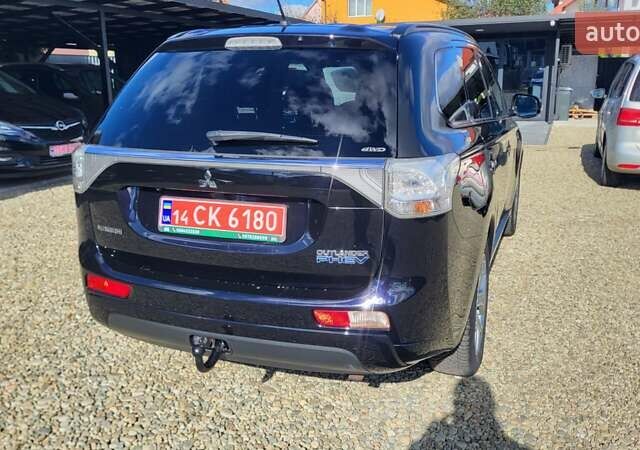 Чорний Міцубісі Аутлендер, об'ємом двигуна 2 л та пробігом 237 тис. км за 13800 $, фото 5 на Automoto.ua