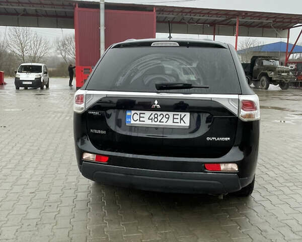 Чорний Міцубісі Аутлендер, об'ємом двигуна 2.4 л та пробігом 150 тис. км за 12200 $, фото 2 на Automoto.ua