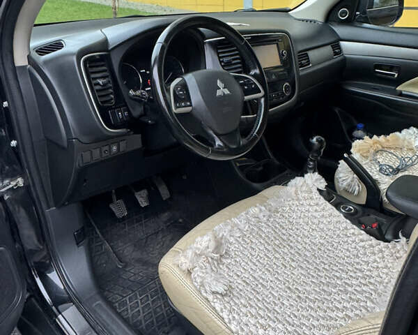 Черный Мицубиси Аутлендер, объемом двигателя 2.27 л и пробегом 244 тыс. км за 14000 $, фото 12 на Automoto.ua