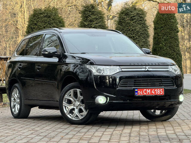 Черный Мицубиси Аутлендер, объемом двигателя 2 л и пробегом 173 тыс. км за 15299 $, фото 1 на Automoto.ua