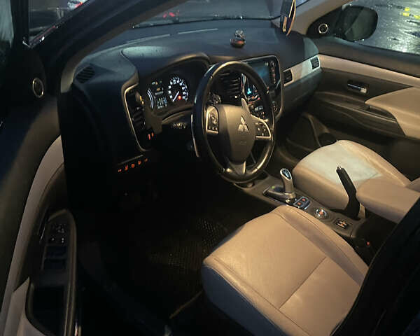 Черный Мицубиси Аутлендер, объемом двигателя 2 л и пробегом 206 тыс. км за 14500 $, фото 12 на Automoto.ua