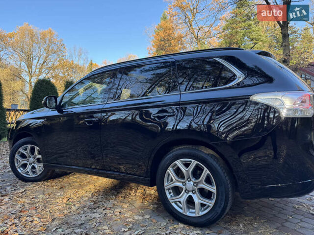 Чорний Міцубісі Аутлендер, об'ємом двигуна 2 л та пробігом 173 тис. км за 15299 $, фото 72 на Automoto.ua