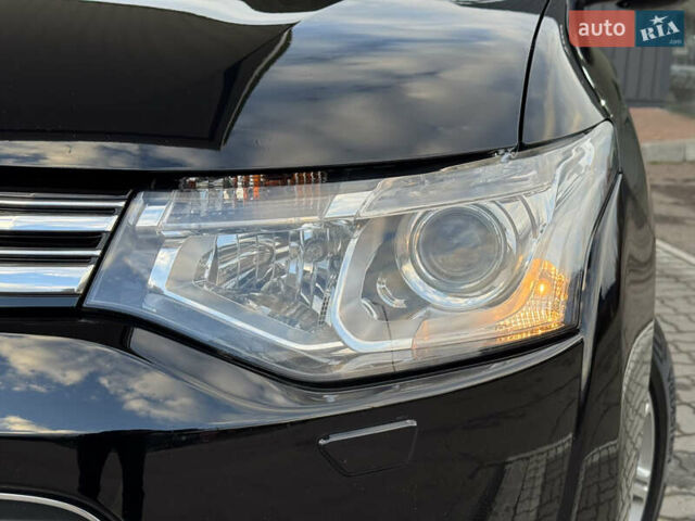 Чорний Міцубісі Аутлендер, об'ємом двигуна 2 л та пробігом 157 тис. км за 15299 $, фото 26 на Automoto.ua
