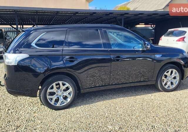 Чорний Міцубісі Аутлендер, об'ємом двигуна 2 л та пробігом 237 тис. км за 13800 $, фото 7 на Automoto.ua
