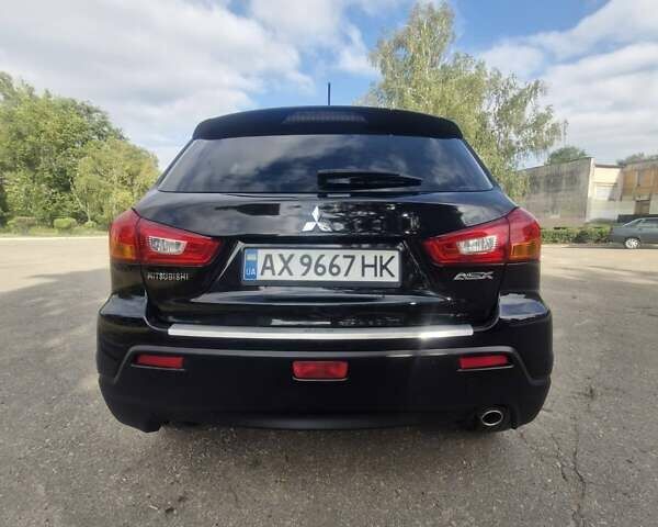 Чорний Міцубісі Аутлендер, об'ємом двигуна 2 л та пробігом 83 тис. км за 13500 $, фото 9 на Automoto.ua