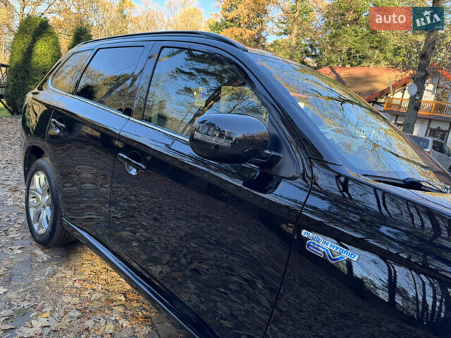 Чорний Міцубісі Аутлендер, об'ємом двигуна 2 л та пробігом 173 тис. км за 15299 $, фото 17 на Automoto.ua